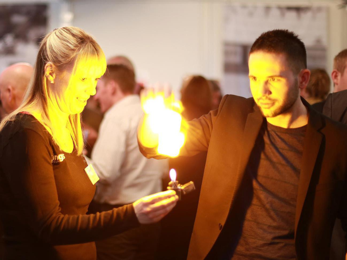 Corporate magician entertaining guests at an event